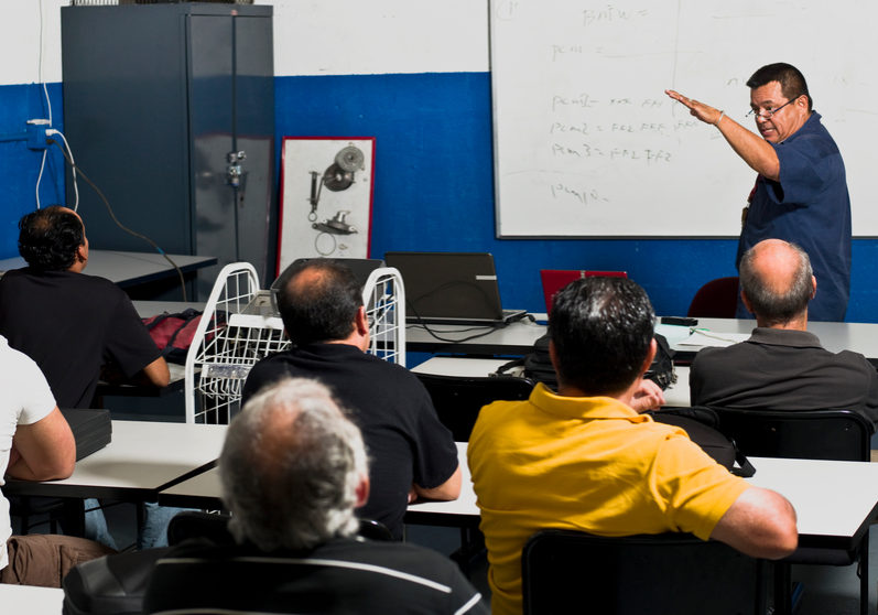 Hispanic Mechanics at a Training Class (this picture has been taken with a Hasselblad H3D II 31 megapixels camera)